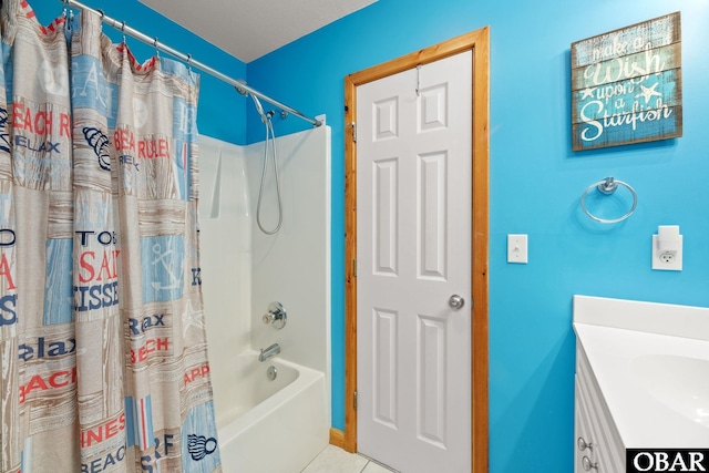 bathroom with shower / bath combo, vanity, and tile patterned floors