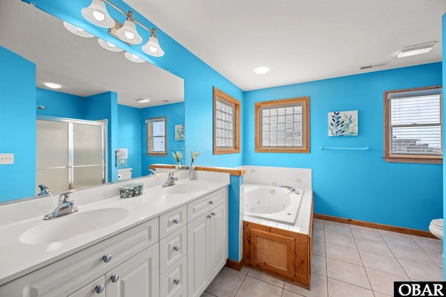 bathroom featuring tile patterned flooring, visible vents, a sink, and toilet