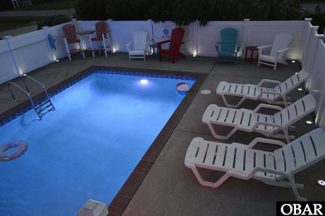 view of pool with a patio area, a fenced backyard, and a fenced in pool