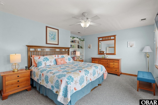 bedroom with carpet floors, baseboards, visible vents, and a ceiling fan