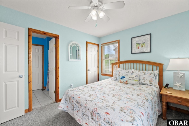 carpeted bedroom featuring a ceiling fan