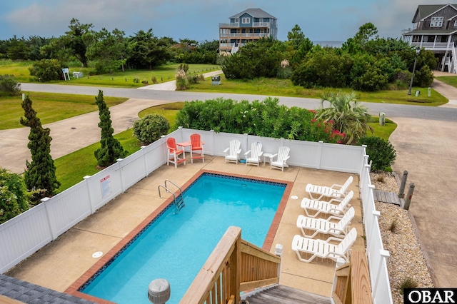 view of pool with a fenced in pool, fence, and a patio