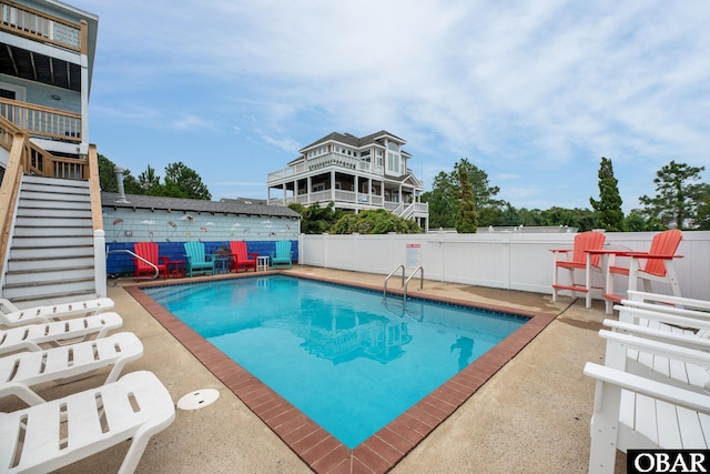 pool featuring a patio area and a fenced backyard