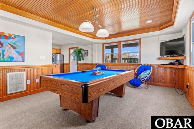 playroom with visible vents, wainscoting, wooden ceiling, a tray ceiling, and wood walls