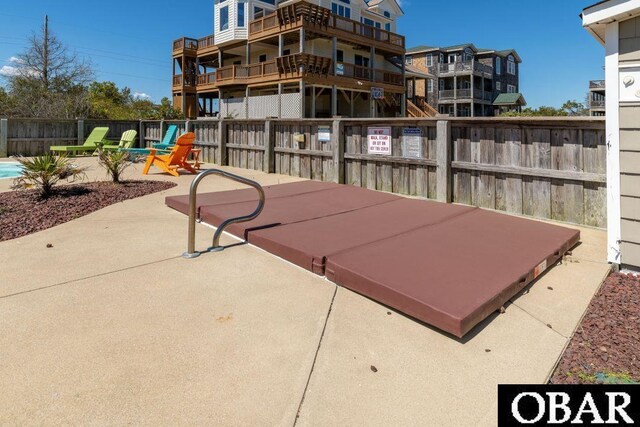 view of patio featuring fence