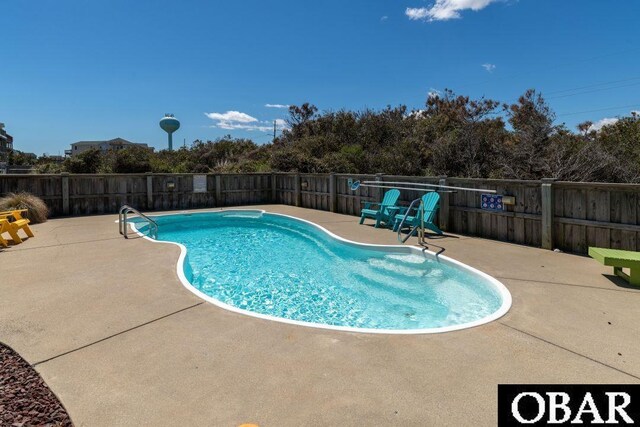 view of pool featuring a fenced backyard, a fenced in pool, and a patio