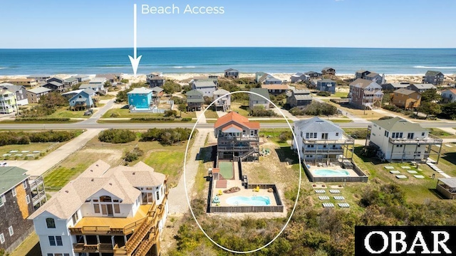 birds eye view of property with a water view and a residential view