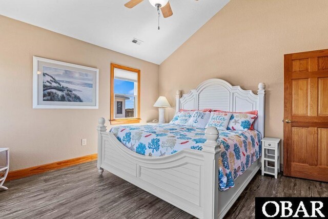 bedroom featuring lofted ceiling, dark wood-type flooring, visible vents, and baseboards