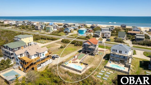 aerial view featuring a water view and a residential view