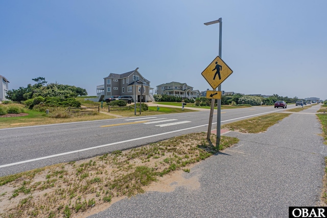 65 Ocean Blvd Lot 3-4, Southern Shores, NC 27949 - view of asphalt street featuring traffic signs