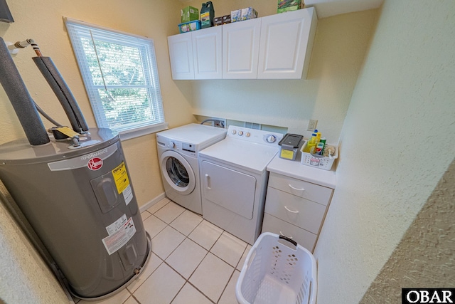 65 Ocean Blvd Lot 3-4, Southern Shores, NC 27949 - laundry area featuring cabinet space, water heater, washer and dryer, and light tile patterned flooring