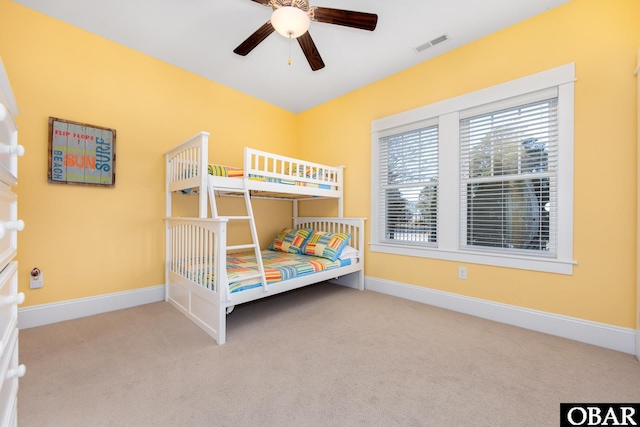 unfurnished bedroom featuring baseboards, visible vents, and carpet flooring