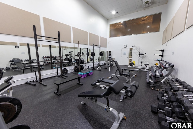 exercise room with a drop ceiling