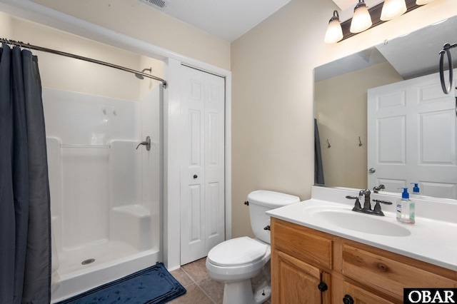 147 Dr Newbern Rd Lot # 3, Powells Point, NC 27966 - bathroom with tile patterned floors, a closet, a stall shower, vanity, and toilet