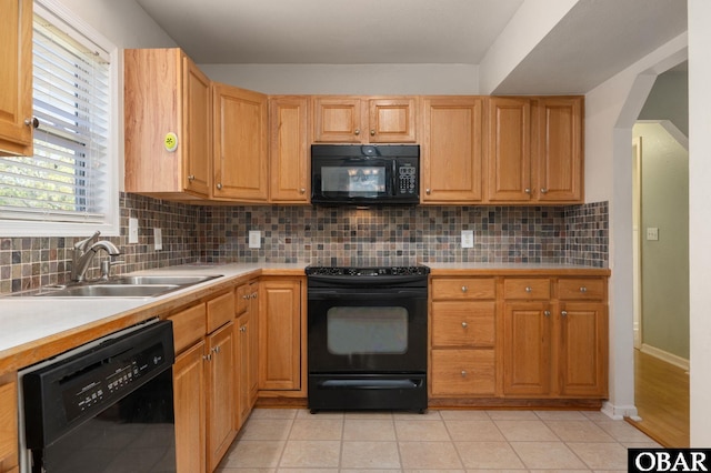 147 Dr Newbern Rd Lot # 3, Powells Point, NC 27966 - kitchen featuring a sink, arched walkways, decorative backsplash, light countertops, and black appliances