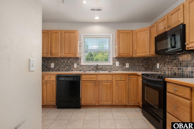 147 Dr Newbern Rd Lot # 3, Powells Point, NC 27966 - kitchen with backsplash, light countertops, visible vents, a sink, and black appliances