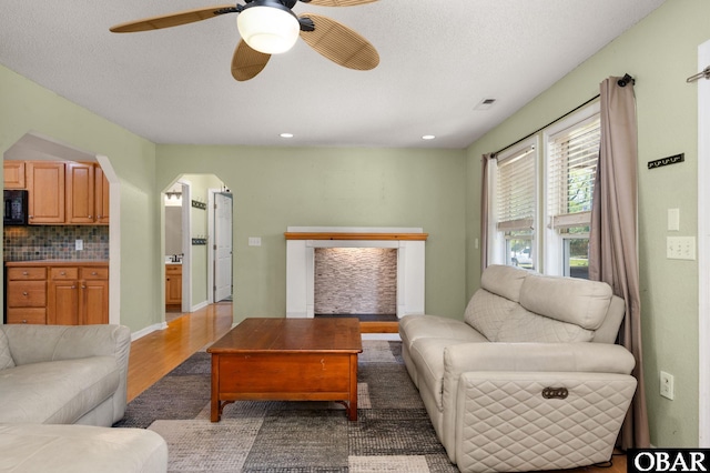 147 Dr Newbern Rd Lot # 3, Powells Point, NC 27966 - living room featuring ceiling fan, arched walkways, wood finished floors, and recessed lighting