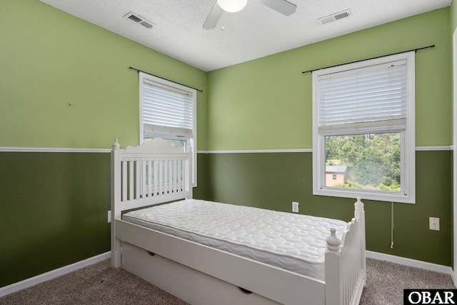 147 Dr Newbern Rd Lot # 3, Powells Point, NC 27966 - carpeted bedroom with ceiling fan, baseboards, a textured ceiling, and visible vents