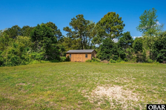147 Dr Newbern Rd Lot # 3, Powells Point, NC 27966 - view of yard featuring an outdoor structure, a forest view, and a shed