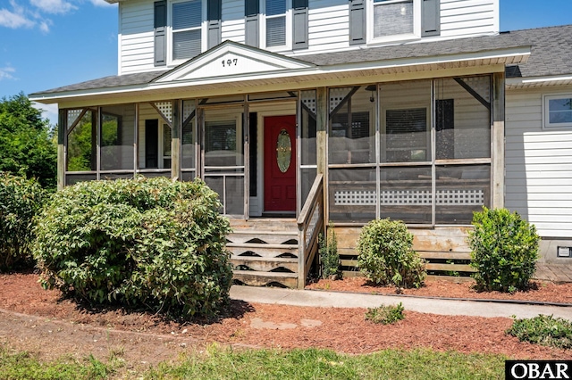 147 Dr Newbern Rd Lot # 3, Powells Point, NC 27966 - view of front of house with a sunroom and roof with shingles