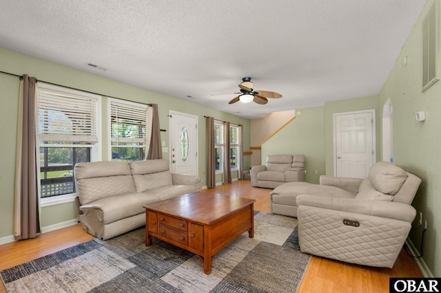 147 Dr Newbern Rd Lot # 3, Powells Point, NC 27966 - living room with a textured ceiling, visible vents, baseboards, wood finished floors, and ceiling fan