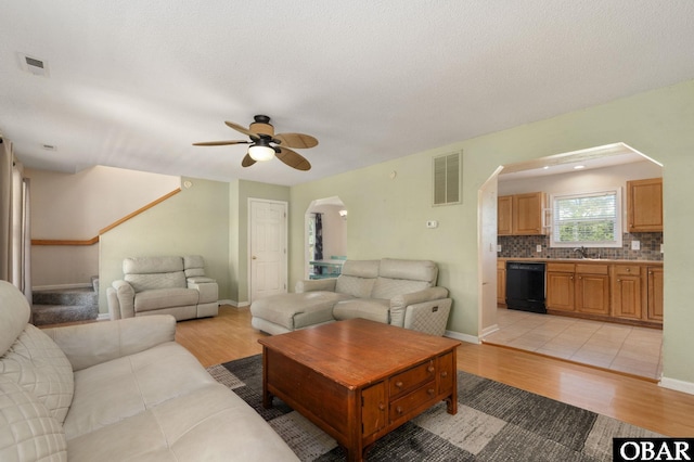 147 Dr Newbern Rd Lot # 3, Powells Point, NC 27966 - living room featuring light wood finished floors, a ceiling fan, visible vents, and arched walkways