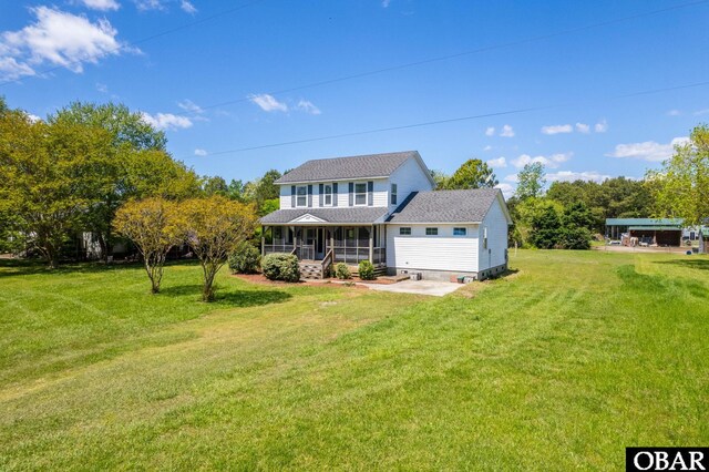 147 Dr Newbern Rd Lot # 3, Powells Point, NC 27966 - rear view of house with roof with shingles, a yard, and covered porch