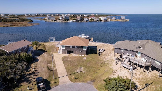 birds eye view of property featuring a water view and a residential view