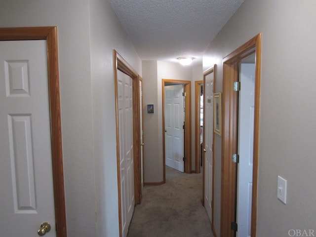 corridor with a textured ceiling