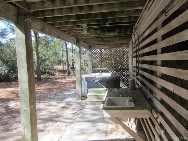 view of patio / terrace featuring a hot tub