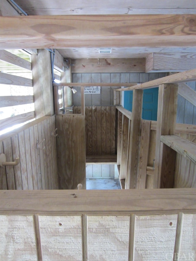 interior space featuring wooden walls