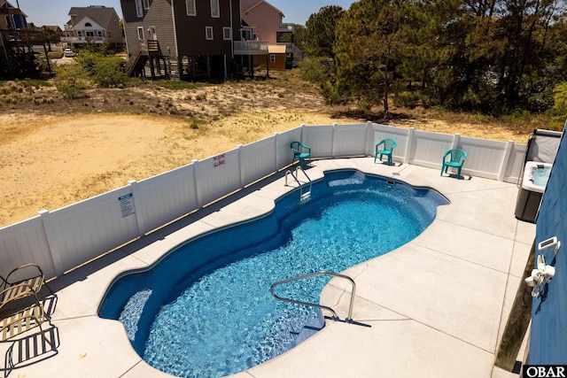 view of pool featuring a patio area, a fenced backyard, and a fenced in pool