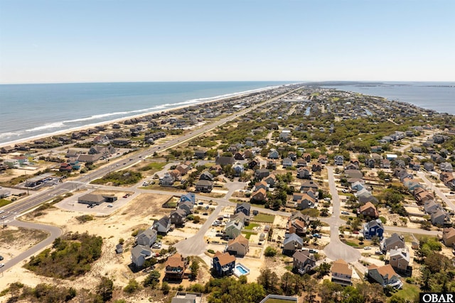 aerial view featuring a water view, a residential view, and a beach view