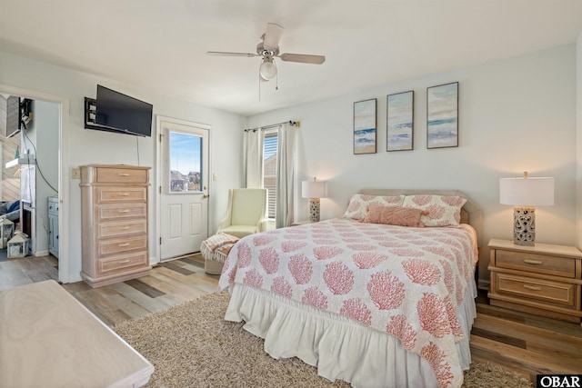 bedroom with ceiling fan and wood finished floors