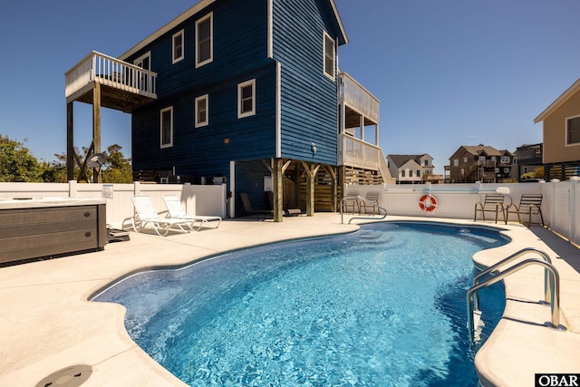 view of swimming pool featuring a residential view, a patio area, a fenced backyard, and a fenced in pool