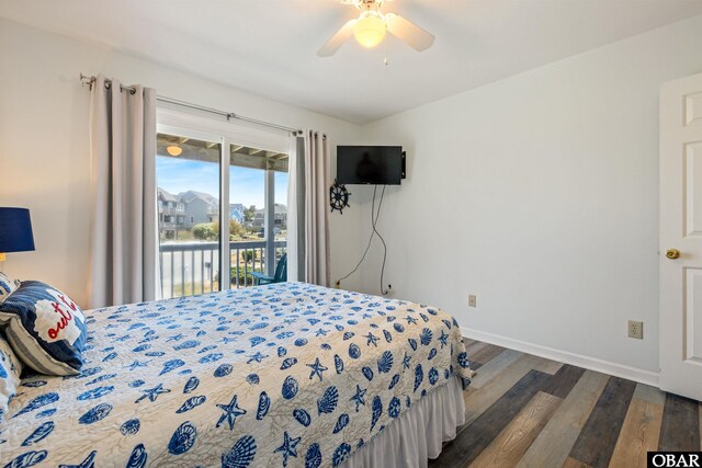 bedroom featuring dark wood-style floors, access to outside, baseboards, and ceiling fan