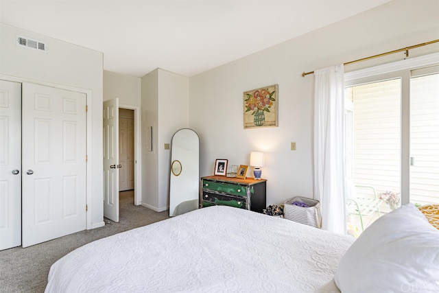 carpeted bedroom featuring a closet, visible vents, and baseboards