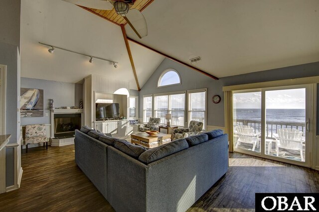 24255 S Shore Dr Lot # 9, Rodanthe, NC 27968 - living room with track lighting, vaulted ceiling, and dark wood-style flooring