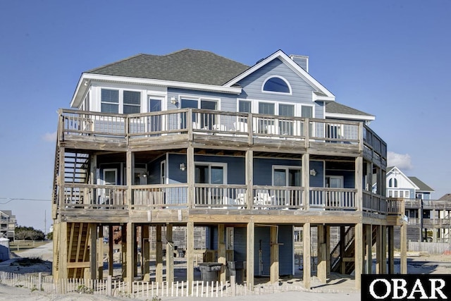 24255 S Shore Dr Lot # 9, Rodanthe, NC 27968 - view of front of house with a wooden deck, a chimney, and roof with shingles