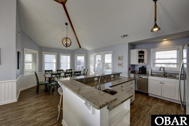 24255 S Shore Dr Lot # 9, Rodanthe, NC 27968 - kitchen with a sink, stainless steel appliances, vaulted ceiling, dark wood-style flooring, and an island with sink