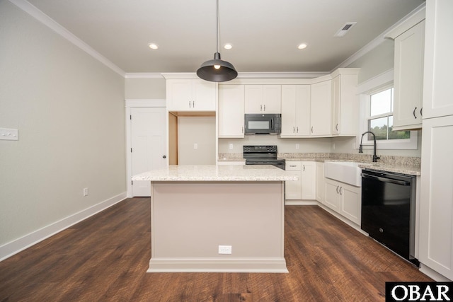329 Country Club Rd Lot A, Lot A, Camden, NC 27921 - kitchen with black appliances, a sink, ornamental molding, white cabinetry, and a center island