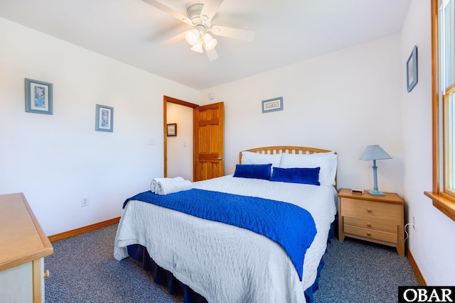 bedroom featuring ceiling fan, dark carpet, and baseboards