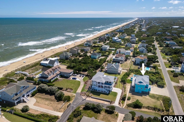 aerial view with a water view, a residential view, and a beach view