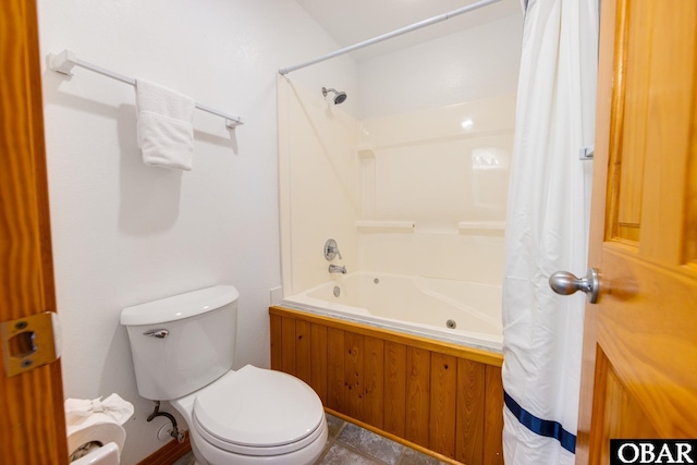 bathroom with shower / bath combo with shower curtain and toilet