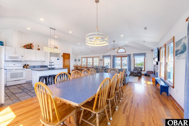 dining area with recessed lighting, visible vents, vaulted ceiling, light wood-type flooring, and baseboards