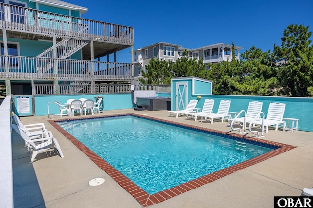 pool featuring a patio and fence