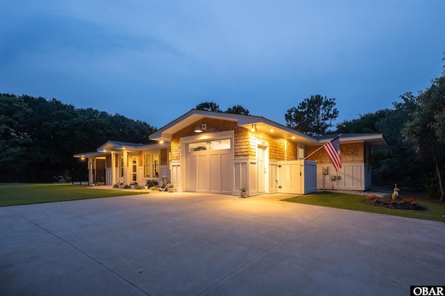 197 Wax Myrtle Trl Lot # 15R, Southern Shores, NC 27949 - view of front of home with an attached garage, concrete driveway, and a front yard