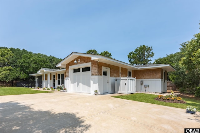 197 Wax Myrtle Trl Lot # 15R, Southern Shores, NC 27949 - view of front facade with an attached garage, concrete driveway, a gate, and covered porch