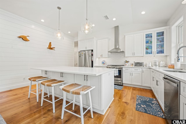 197 Wax Myrtle Trl Lot # 15R, Southern Shores, NC 27949 - kitchen featuring appliances with stainless steel finishes, wall chimney exhaust hood, a sink, backsplash, and recessed lighting