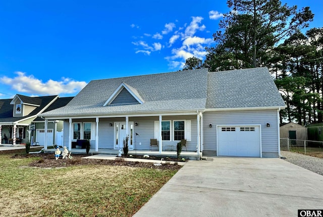 view of front of property featuring fence, roof with shingles, a porch, an attached garage, and concrete driveway